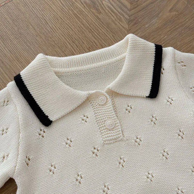 Barboteuse crème col polo pour bébé en maille ajourée