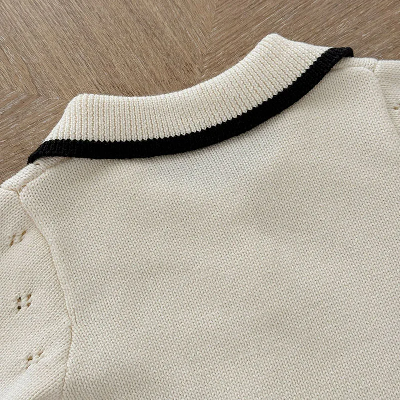 Vêtements bébé chic barboteuse crème maille ajourée