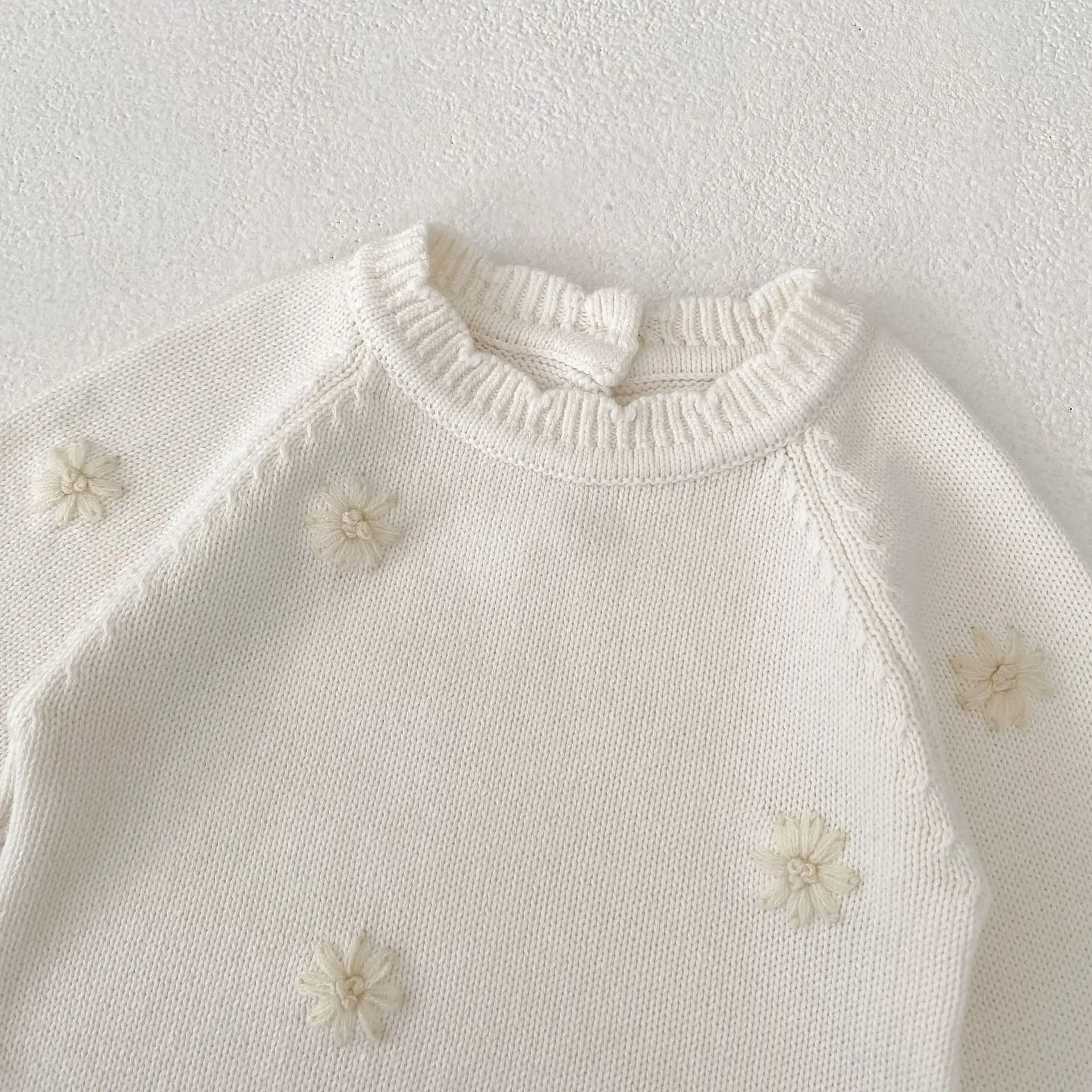Vêtements bébé élégants barboteuse tricot fleurs