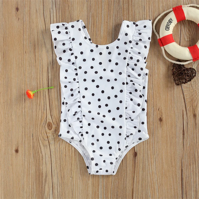 Maillot de bain bébé blanc à pois noirs une pièce volanté