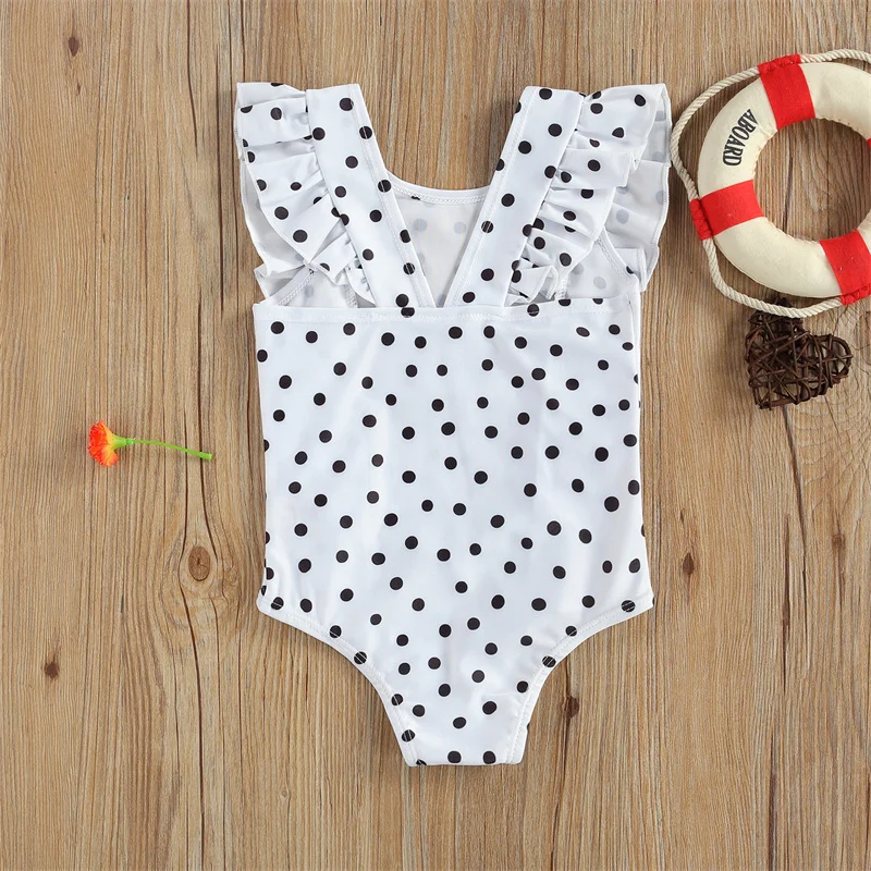 Maillot de bain bébé blanc à pois noirs une pièce volanté