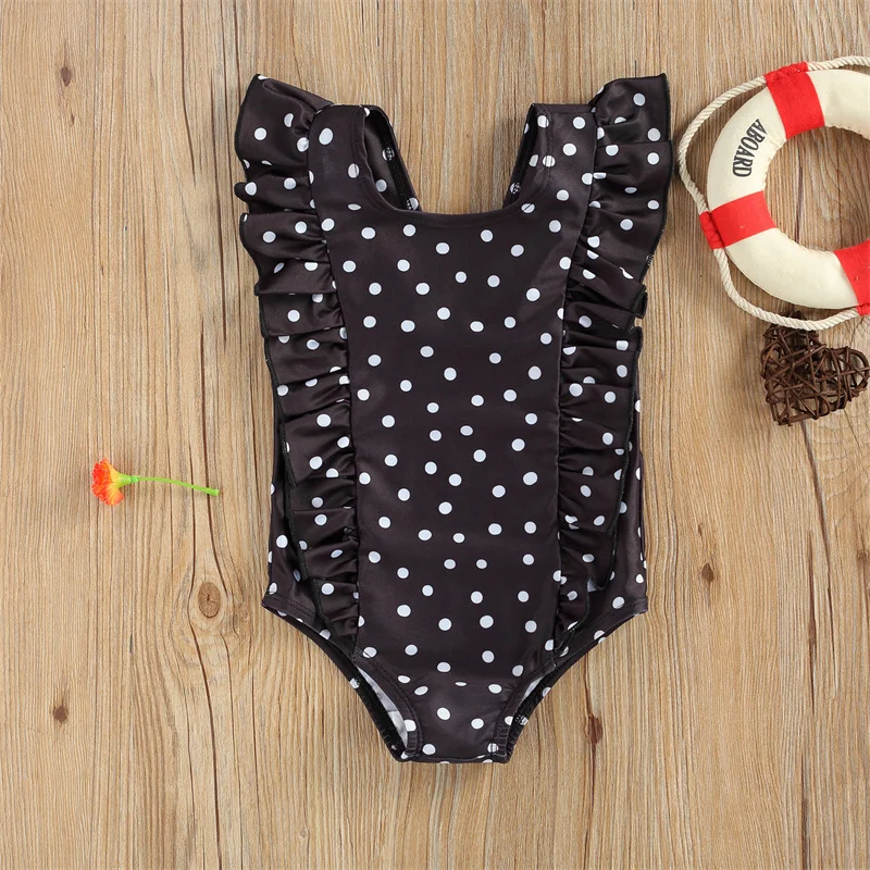 Maillot de bain bébé noir à pois blancs une pièce volanté